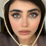 لنز رنگی چشم آلیانز (سبز طوسی با مرکزیت عسلی و دور مشکی)